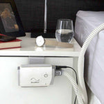 ResMed AirMini travel CPAP secured in the AirMini Mount System